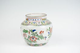 An early 19th Century famille verte planter pot with a wide floral panel to the body and the neck