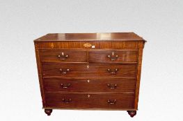 An early 19th Century mahogany chest of three long and two short drawers, the narrow upper panel