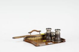 A wooden crumb tray and brush; and a pair of old binoculars.