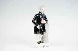 A 19th Century Staffordshire pottery figure of the Rev John Elies (sic), 14 ins (36 cms) high.