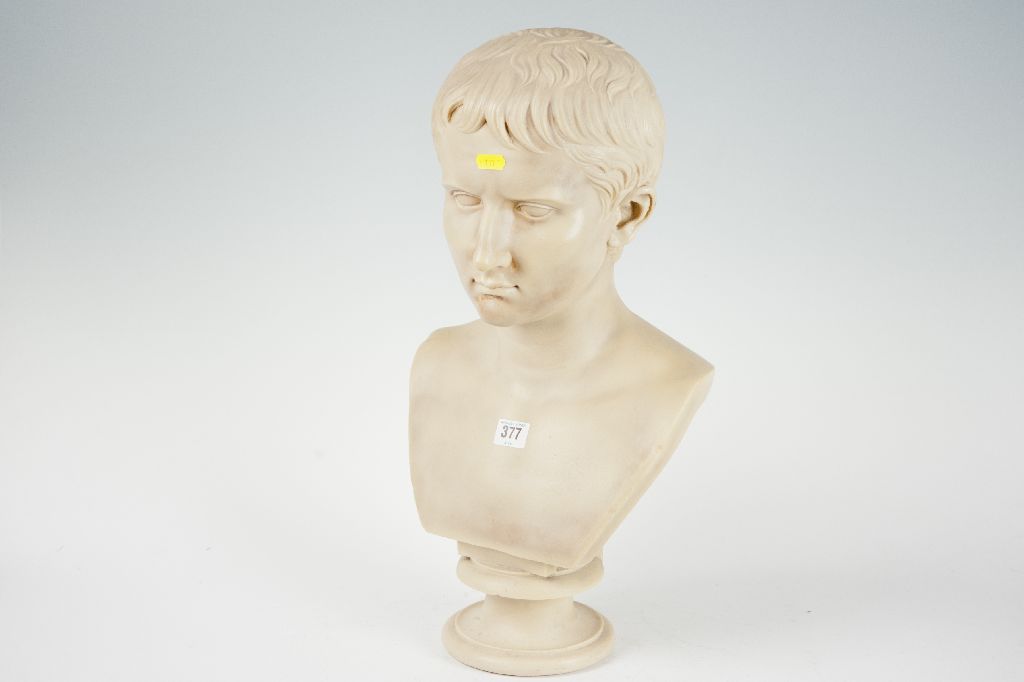 A large alabaster bust of a young classical style boy, 20 ins (51 cms) high.