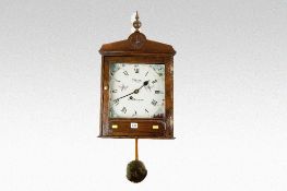 A polished encased pendulum wall clock having a painted dial with single fusee movement marked `T