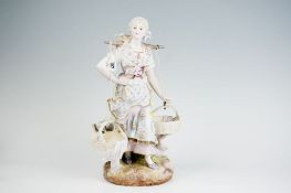 A, possibly Minton, floral parian figurine of a maiden in flowing apron and with a yoke and two
