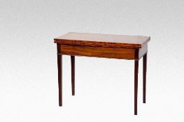 An oblong topped mahogany and string inlaid fold over tea table on square tapered supports.