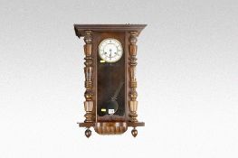 A polished encased Vienna style pendulum wall clock (for full restoration).