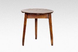 A circular top pine cricket style table on square tapered supports.