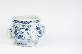 A late 18th/early 19th Century Chinese blue and white dragon decorated cylindrical pot with elephant