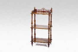 A Victorian walnut and floral inlaid triple shelf whatnot, the top shelf having a fretwork gallery
