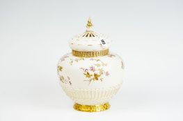 A large Royal Worcester blush ground vase having a basket weave base with painted floral