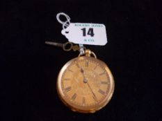 An eighteen carat gold encased bright cut lady`s key wind fob watch sold by Russells of Liverpool.