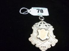 A large silver watch pendant, uninscribed, Birmingham 1898, 24.5 grms (0.75 ozs).