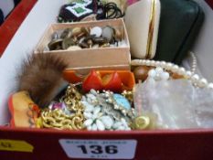 A large parcel of mixed dress and bead jewellery, and two travelling clocks, etc.