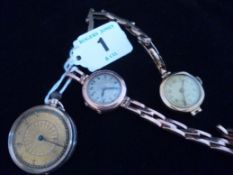 A nine carat gold encased lady`s circular fob watch (for attention) and two other nine carat gold