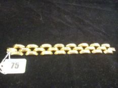 An eighteen carat gold triple bar link bracelet, 41 grms.