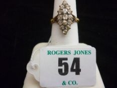 A lady`s eighteen carat diamond dress ring, the fifteen diamonds set in a pear shape and with