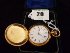A lady`s eighteen carat gold encased hunter pocket watch with white enamel dial and Roman numerals