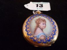 A part gold encased lady`s fob watch with black Roman numerals (worn) and a gold and enamel back