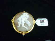 A large pinchbeck framed cameo brooch of winged cherubic figures, cameo length approximately 60 mm.