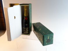A pair of Moet a Chandon 1990 vintage champagne bottles in presentation boxes