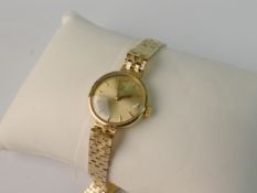 OMEGA, A GOLD (9ct) AUTOMATIC WRISTWATCH; The copper finished lever movement seventeen jewels,