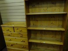 Two pine bookcases of four shelves and a chest of drawers