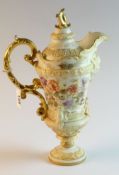 A Continental blush single handled lidded jug with painted floral decoration, 11 ins (28 cms) high