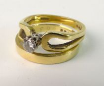 A MATRIMONIAL PAIR OF GOLD RINGS; The single stone modern brilliant cut diamond in eight claw