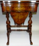 A Victorian sewing and games table with inlaid walnut hinged top opening to reveal mahogany and