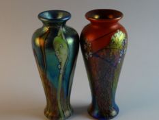 Two lustrous art glass narrow necked baluster vases, one entitled `Atlantis` and the other by D