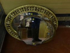 An Edwardian inlaid oval wall mirror; and three other sundry wall mirrors