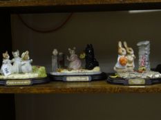Three Beswick Beatrix Potter tableau groups all on wood effect bases - `Hiding from the Cat`, `
