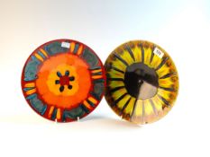 POOLE A shallow dish with sunburst style pattern, 10 ins (27 cms) diameter and a similar `Volcano`