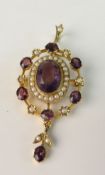 AN EDWARDIAN PENDANT BROOCH; With central oval mixed cut amethyst (1.5 mm x 1 mm) surrounded by half