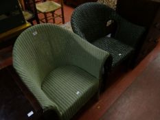 A Lloyd Loom chair painted green; and one other green wicker chair