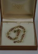 Ladies` gold (9ct) two tone fancy link bracelet with Clogau Welsh gold certificate. All at