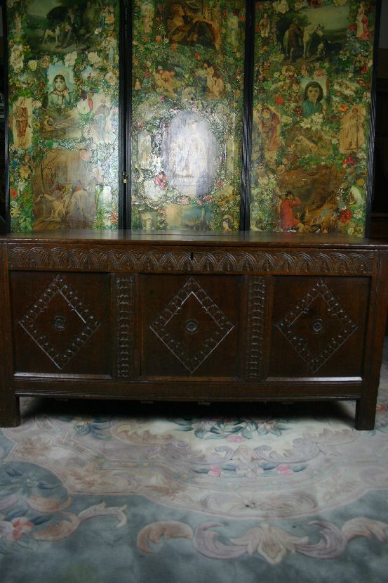 An 18th Century oak blanket chest, the front having a narrow lunette top panel over three inset