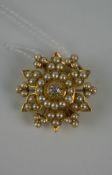 Fine late Victorian yellow metal (believed gold), half seed pearl and diamond floral pendant