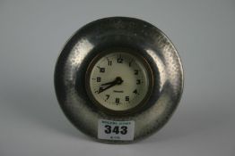 An early 20th Century Liberty & Co Tudric pewter mantel clock with later circular dial, Roman