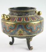 A three footed polychrome floral patterned Oriental censor