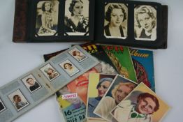 Two boxes of early 20th Century motion picture ephemera including photo albums with stills from