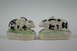 A pair of rare 19th Century miniature Staffordshire black and white rabbits, 2.5 ins (6.5) long (