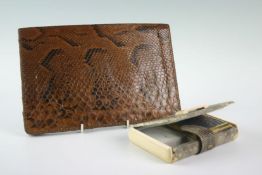 A snakeskin leather clutch purse; and similar lady`s travel case