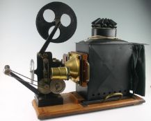 A Victorian British made W.B. and Sons Ltd magic lantern projector on a pine plinth, together with
