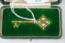 Unique gold (9ct) key for the Ibadan Council Hall of Gothic design with quatrefoil handle inlaid