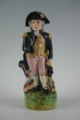 A good 19th Century Staffordshire model of Admiral Nelson in the form of a jug, 11.5 ins (29.5 cm)