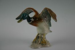 A Beswick ceramic figurine of duck in flight, serial number 750, 6.25 ins (16 cms) high