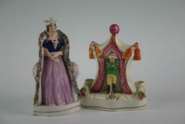 A Staffordshire figure of a crowned lady sitting in a garden chair; and another of a military