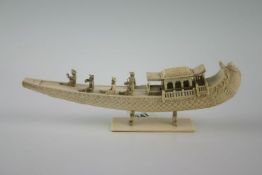 An early 20th Century Continental ivory decorative item in the form of a vessel, gondola-type, on