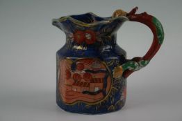 A believed 19th Century Masons faceted jug Imari pattern and having a dragon handle