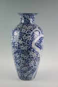 A large 20th Century blue and white `Prunus Blossom` baluster vase, 21 ins (53 cm) high